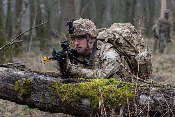 Soldier in uniform holding rifle in battle drill